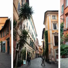 Ruelles étroites et pavées de la ville de Rome, bordées de bâtiments aux façades colorées et ornées de plantes vertes.