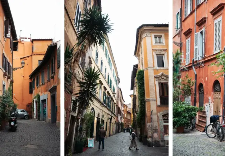 Ruelles étroites et pavées de la ville de Rome, bordées de bâtiments aux façades colorées et ornées de plantes vertes.